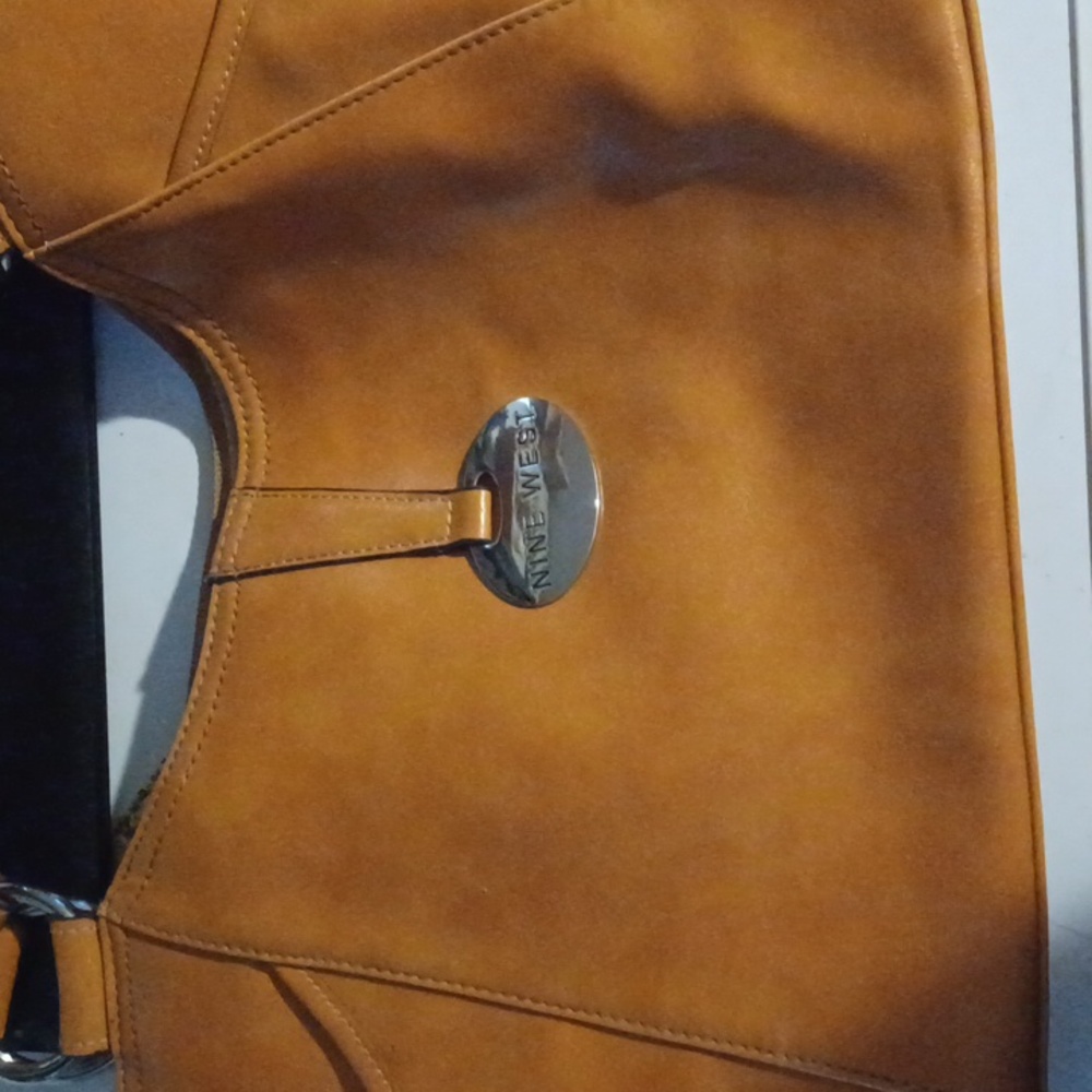 This is a nine west brown leather purse